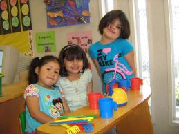 3 girls with kitchen utensils